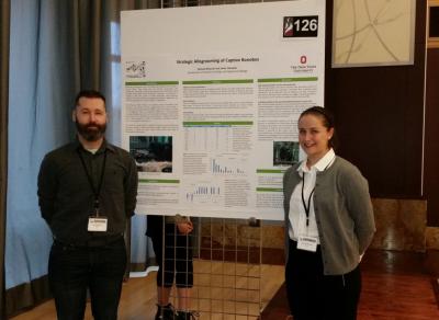 Jamie & Chelsea in front of research poster at Denman Undergraduate Research Forum