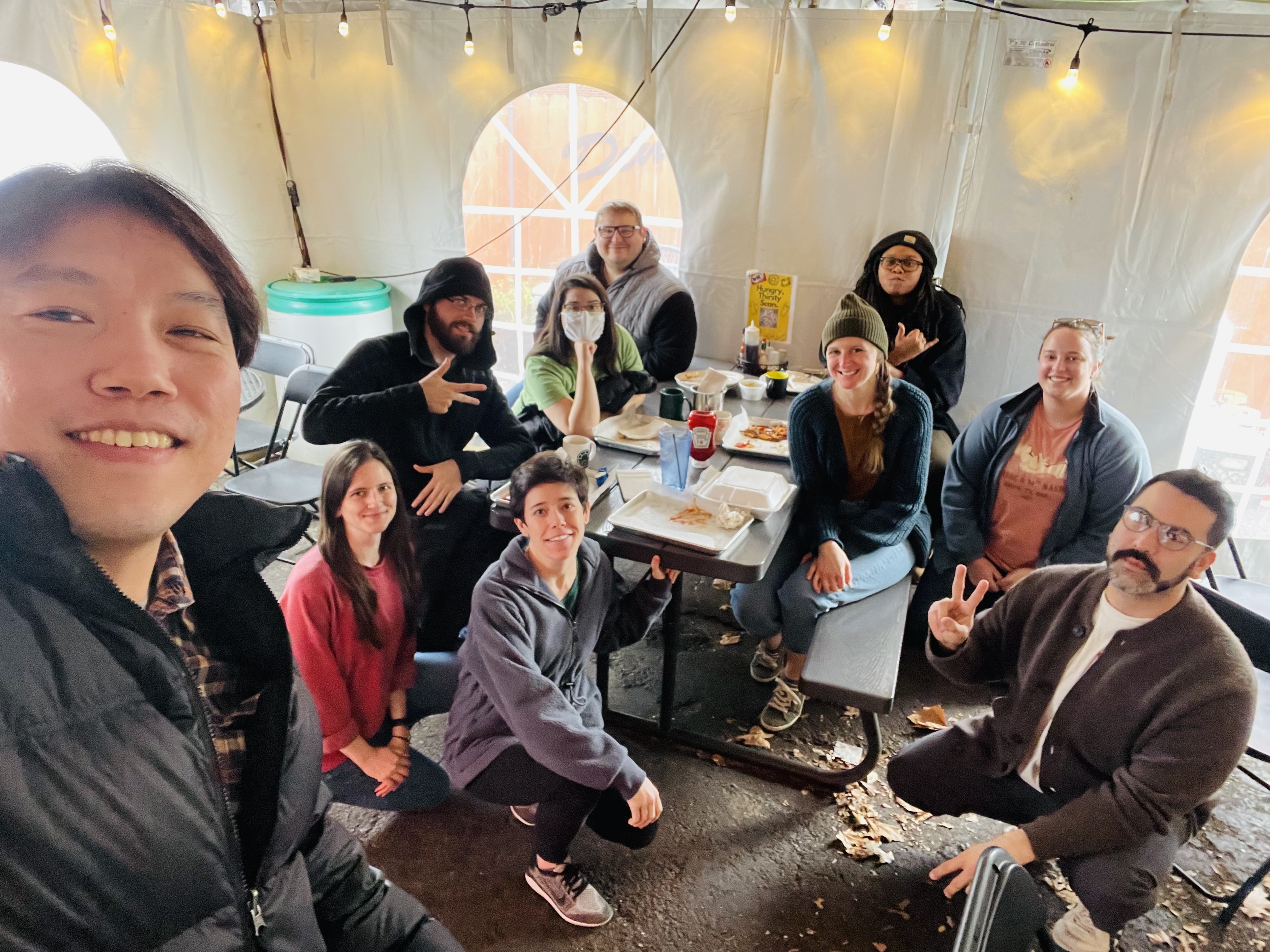 group of EEOB graduate students under an event tent at the Museum of Biological Diversity (MBD)