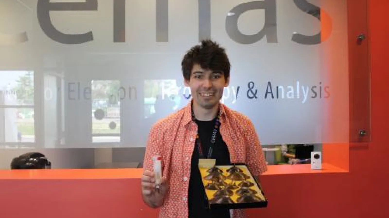nate shoots holding box of mussels in front of CEMAS