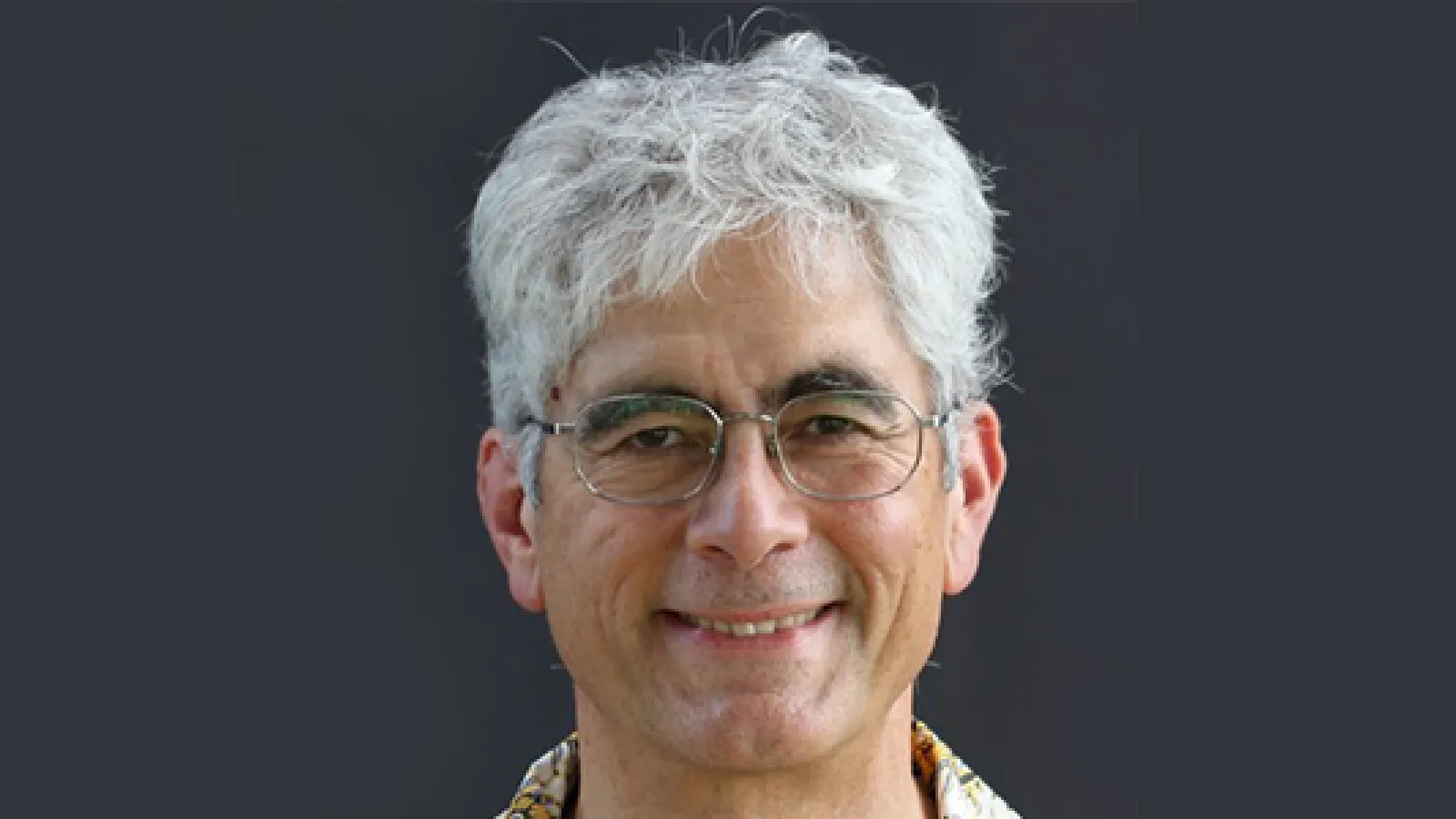 headshot of John hunter in front of gray background