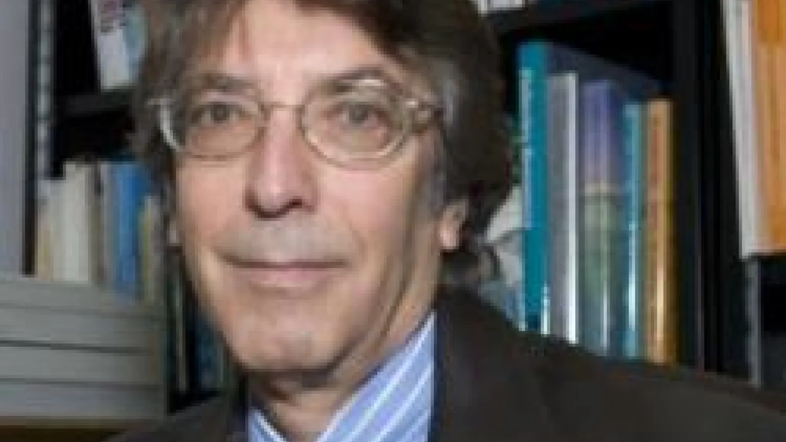 headshot of tim berra in front of bookshelf