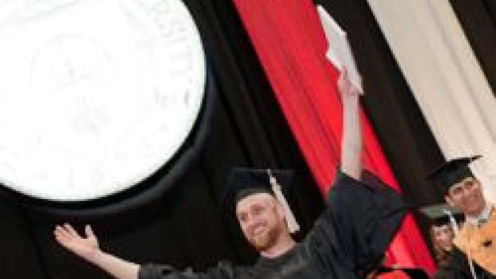 happy graduate at commencement