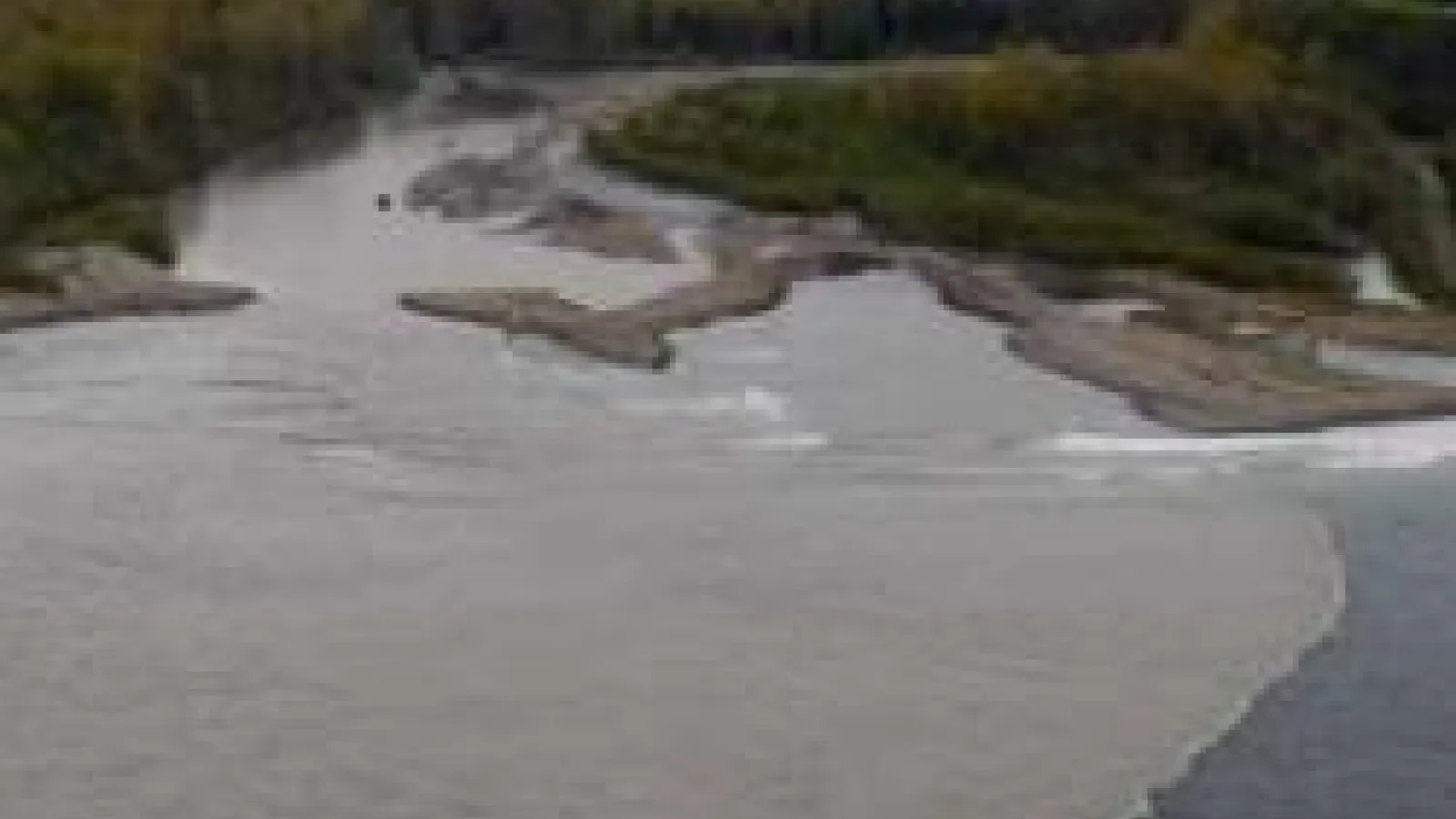 aerial view of turbid river outlet