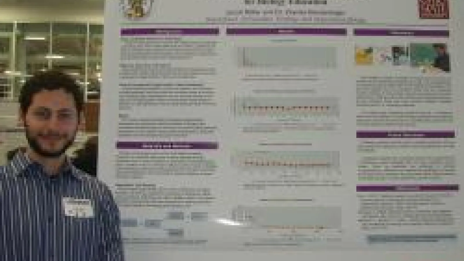 Jacob Miller at Denman Forum standing with his poster