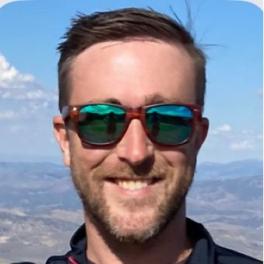 headshot of Aaron Wenzel outside