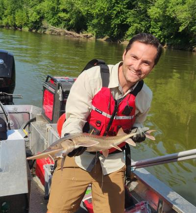 Jon Horn holding a shovelnose sturgeon