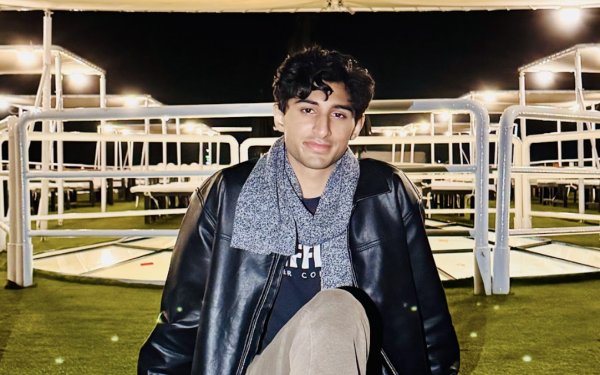 salah mohammed sitting on ground under canopy