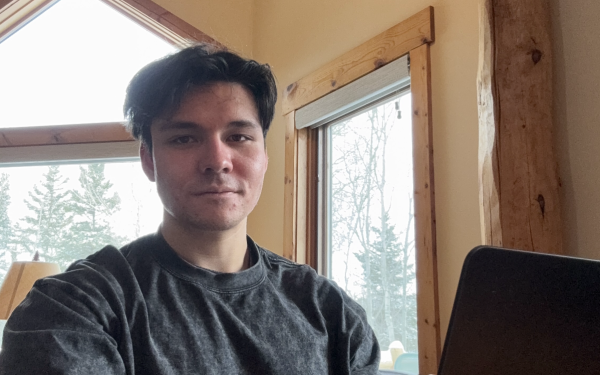 Reid Martin sitting in front of laptop