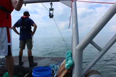 Neal Banaszak standing on research vessel