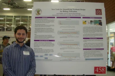 Jacob Miller in front of research poster at Denman