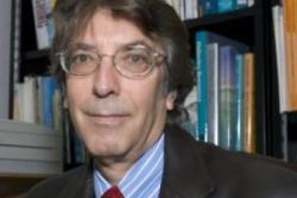 headshot of tim berra in front of bookshelf