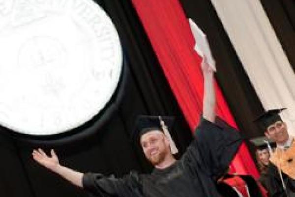 happy graduate at commencement