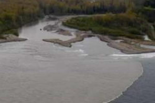 aerial view of turbid river outlet