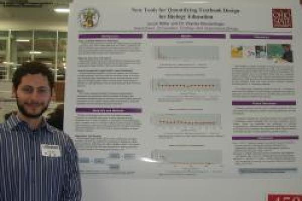 Jacob Miller at Denman Forum standing with his poster