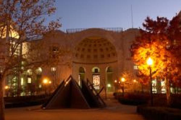 Jesse Owens memorial in front of north end of Ohio Stadium at dusk in the fall