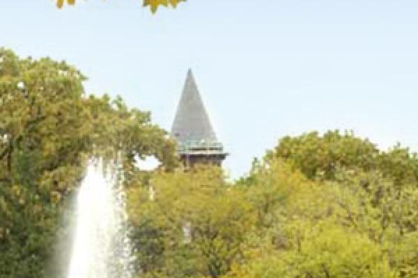 mirror lake fountain crest in front of tower in autumn