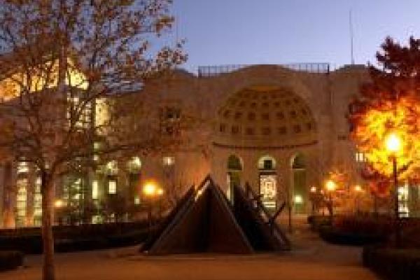 Jesse Owens memorial in front of north end of Ohio Stadium at dusk in autumn