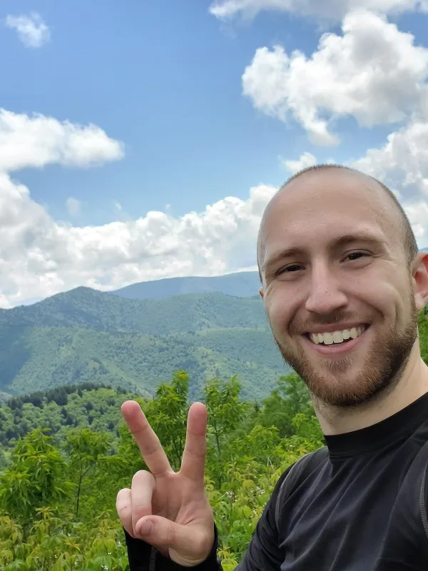Headshot of Eric Shershen in front of the Smoky Mountains 