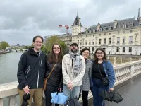 Serb Lab standing on bridge by Museum of Natural History, Paris, France