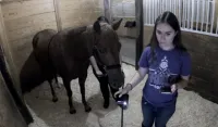 Rachel 3/4 turn while holding horse's lead with horse beside her